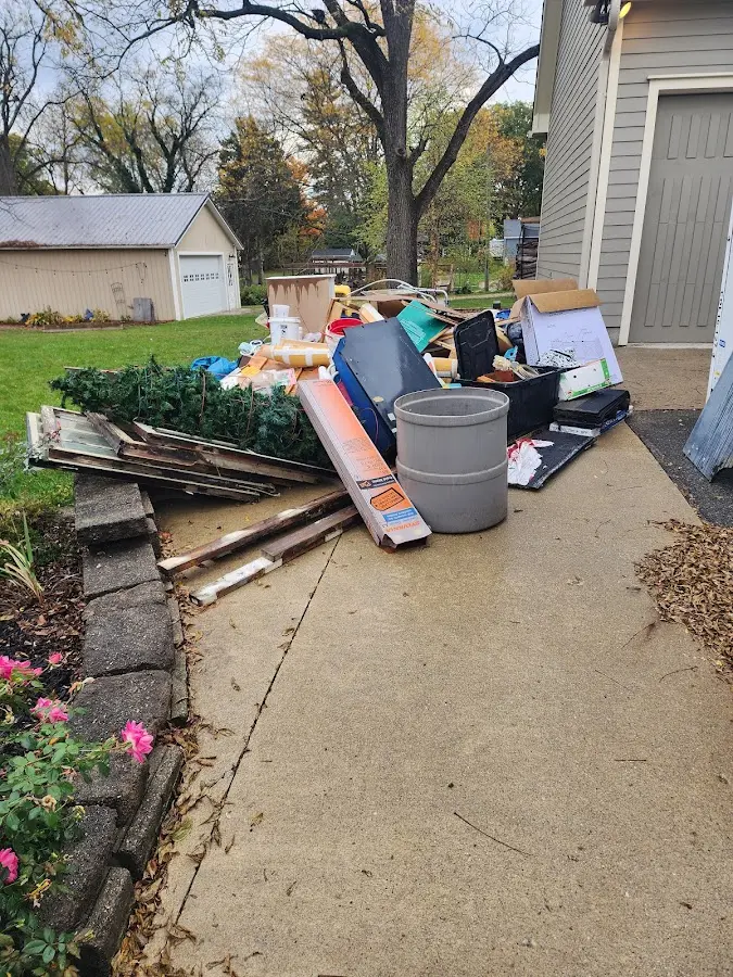 Dumpster being loaded with debris for 30 Yard Dumpster Rental in St. Joseph